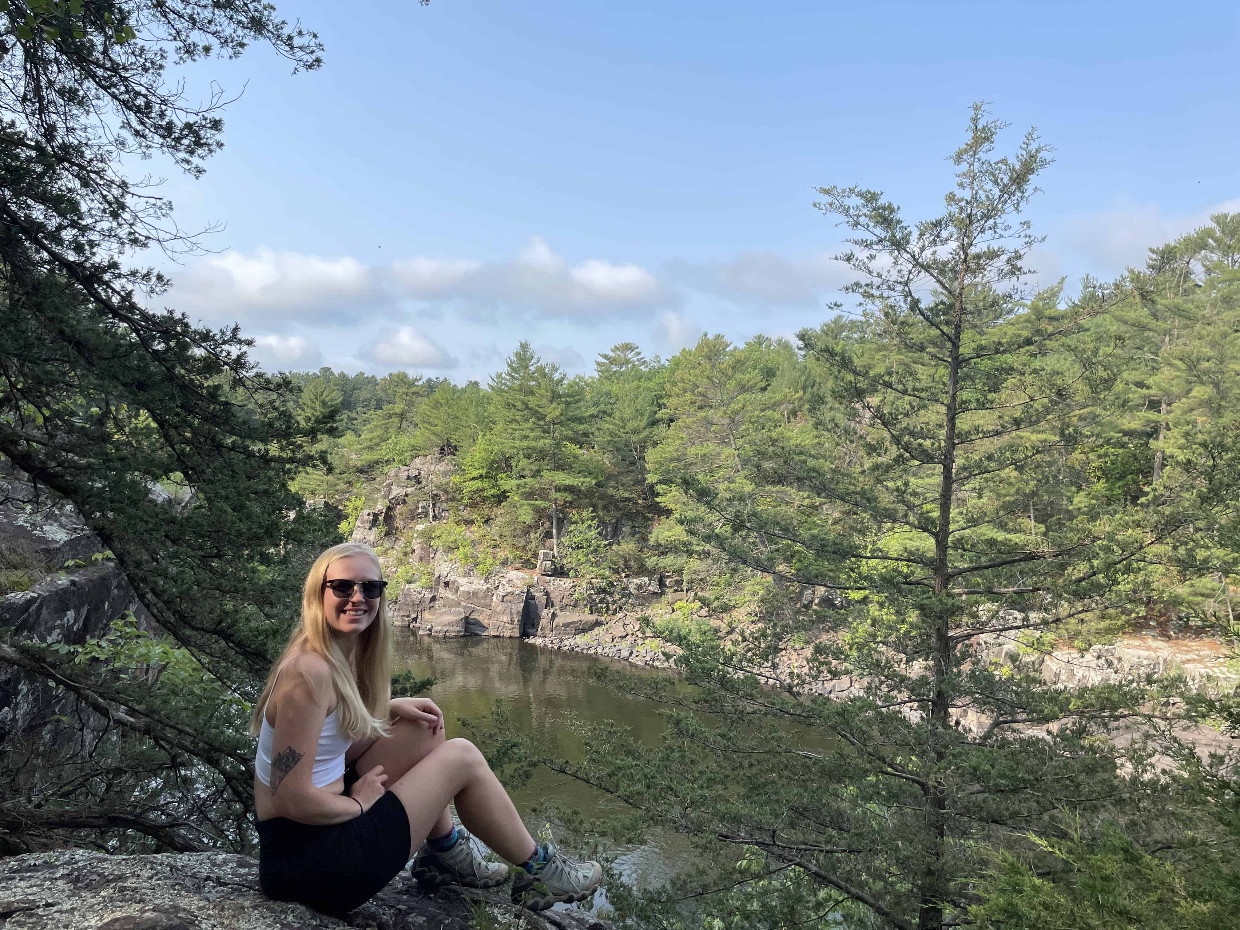 Myself sitting on an overlook on the St. Croix River during the best time of year to visit Minnesota, summer.