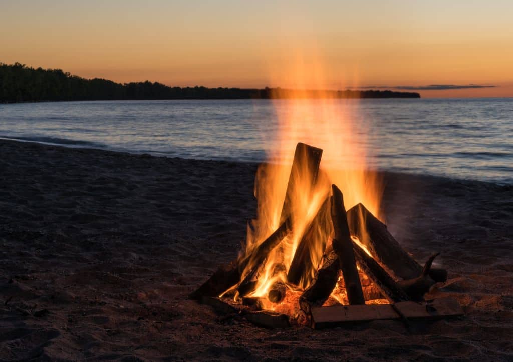 Having a bonfire on the beach is a great way to relax.
