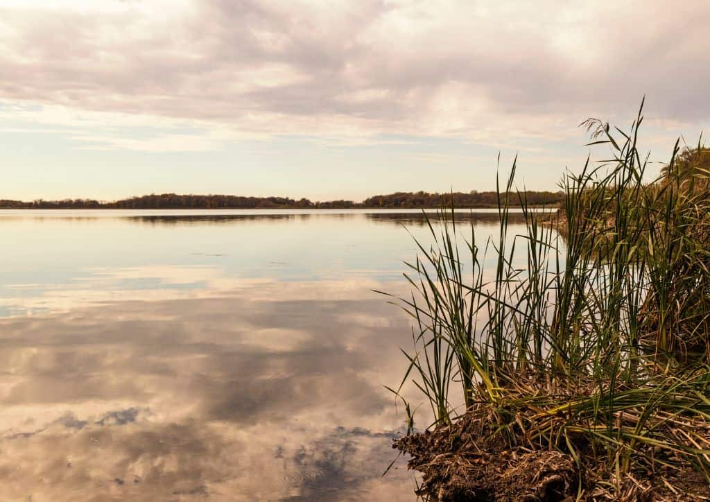 Sitting near a lake is a great way to relax at a resort.