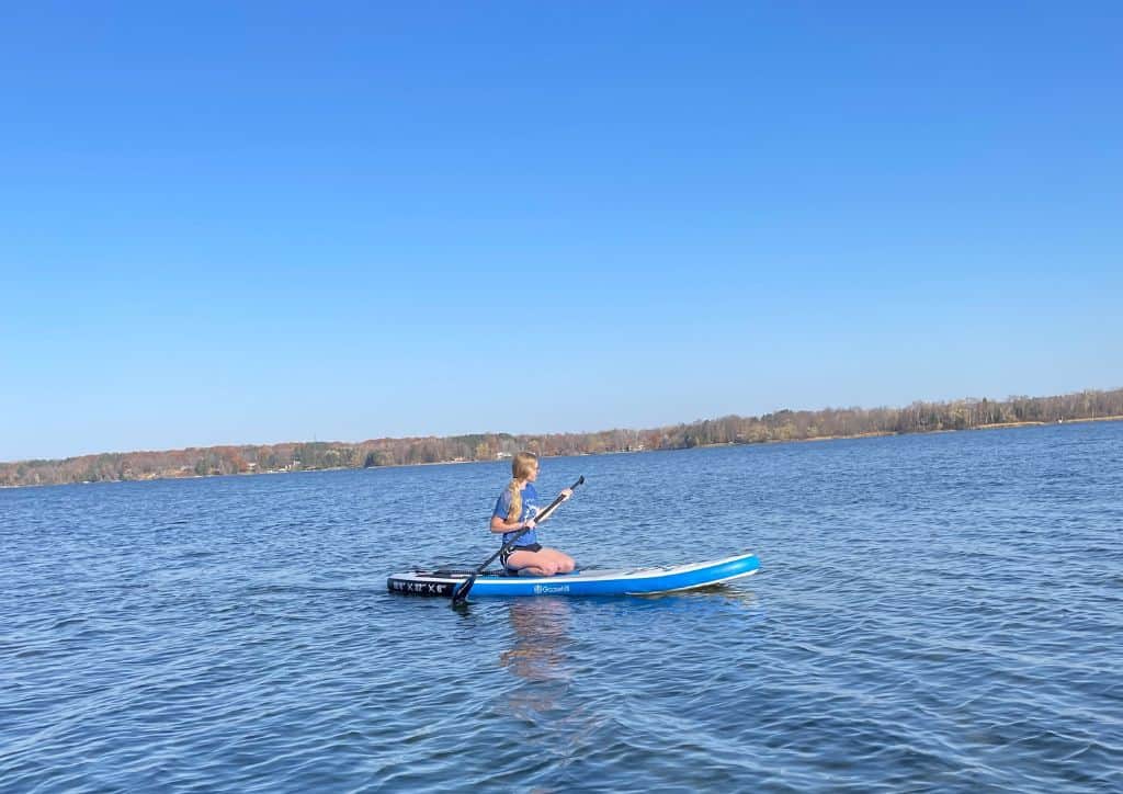 Myself on a paddle board on a lake in Minnesota.