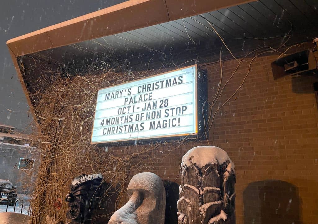 A sign that tells visitors when Mary's Christmas Palace takes place.