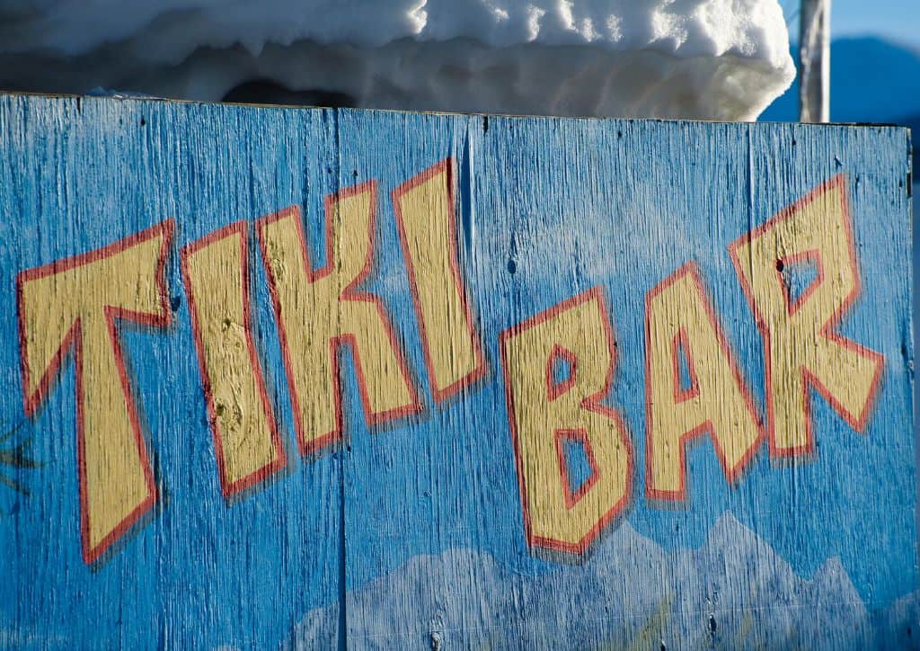 A blue sign that reads 'tiki bar'.