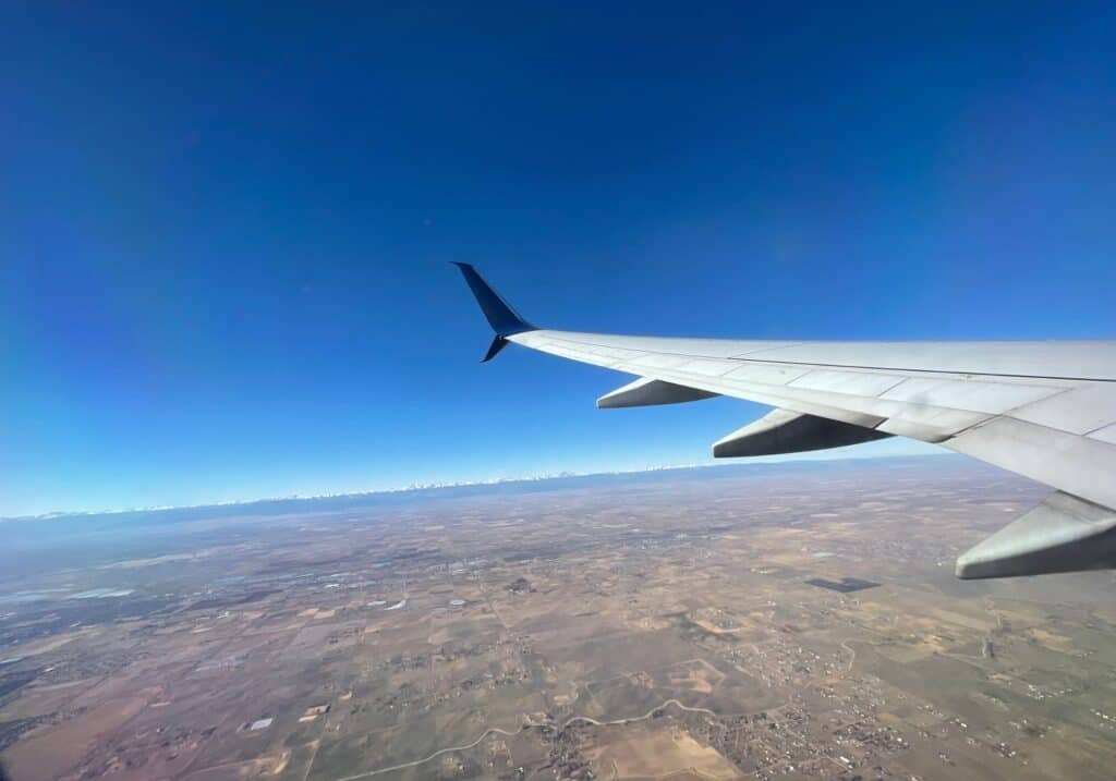 A view of the land outside of a plane window, after taking off from a park and fly hotel in Minneapolis.