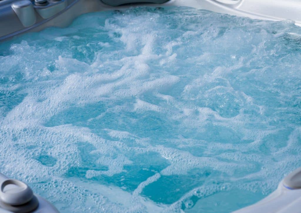 The bubbling water in a private hot tub.