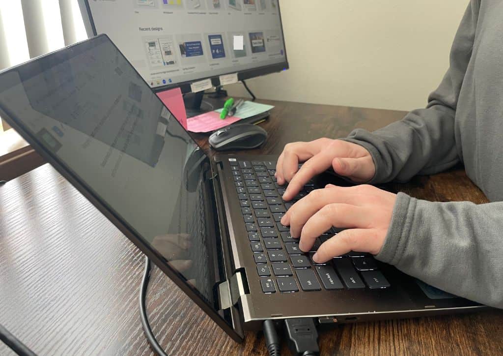 Myself typing at my computer, writing a post on my blogging platform.