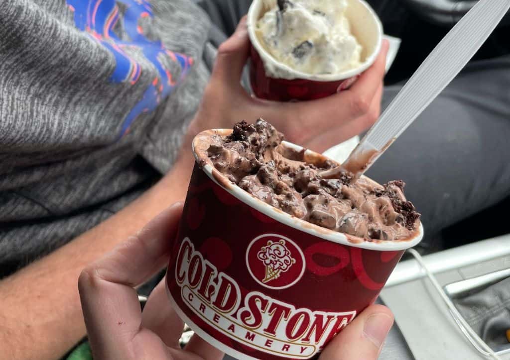 Holding a cup of ice cream in Duluth, MN from Cold Stone.