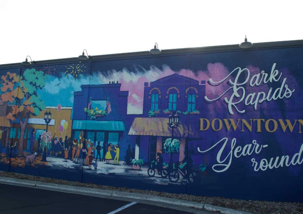 A sign that reads "Park Rapids Downtown year-round" on Main Street.