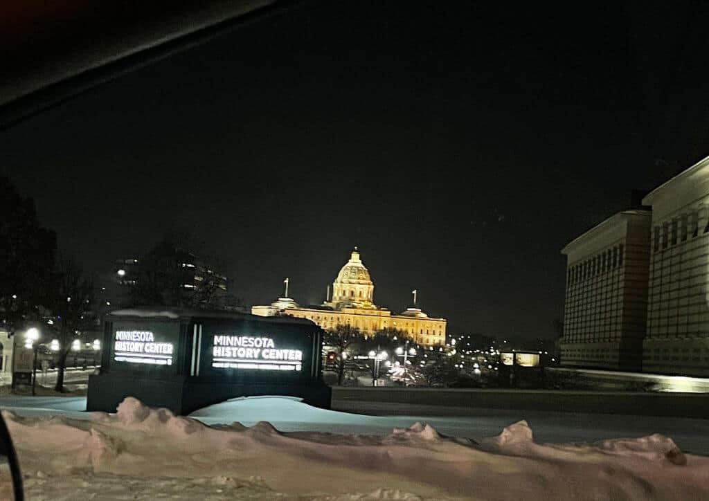 The St. Paul capital building lit up at night time.