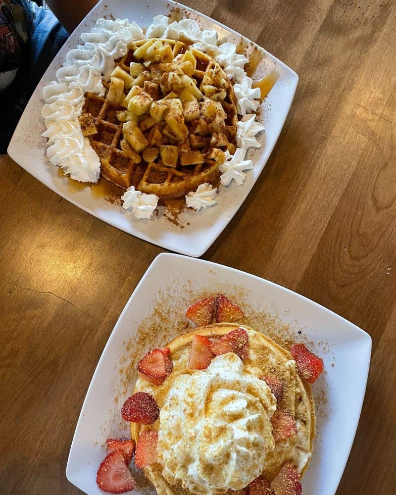 Two waffles on a plate at Black Coffee and Waffle Bar.