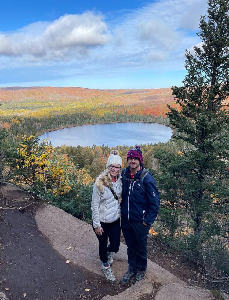 Myself and Tyler standing at an overlook of Oberg Mountain during fall, where you can see fall colors.